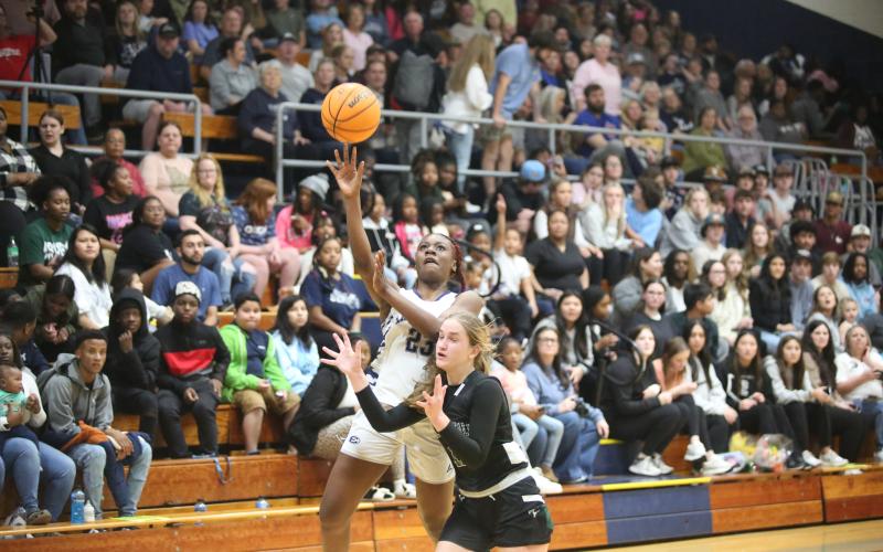 Zy Belcher floats a shot over a Tallulah Falls defender during Elbert’s loss to the Lady Indians Jan. 26. (Photo by Wells)