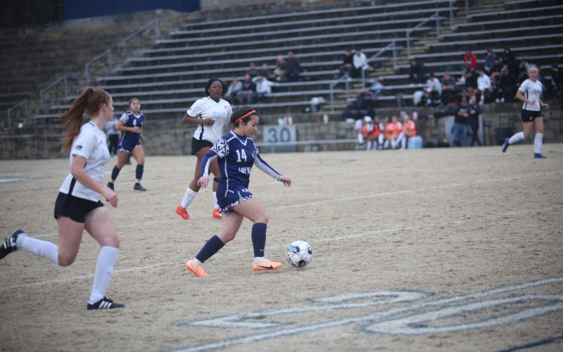 Carina Medellin dribbles down the field. (File photo by Wells)