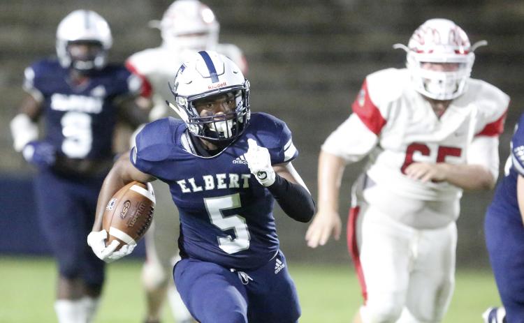Blue Devil junior running back C.J. Tate rushes for an 80-yard touchdown during Elbert County’s 56-7 region win over Social Circle Friday night Sept. 27 in the Granite Bowl in Elberton (Photo by Cary Best).