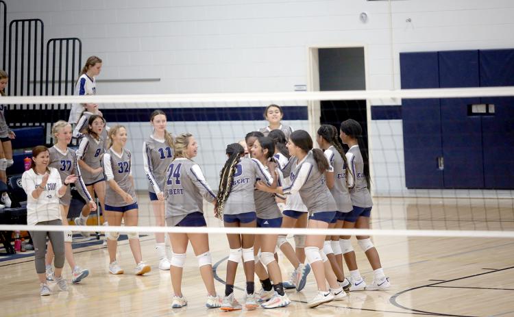 The Lady Rams volleyball team celebrates after Sophia Vargas gets an ace to seal a victory over Habersham Sept. 6. The Lady Rams controlled the match from start to finish as they won the first set 25-12 and the second set 25-11. (Photo by Wells) 
