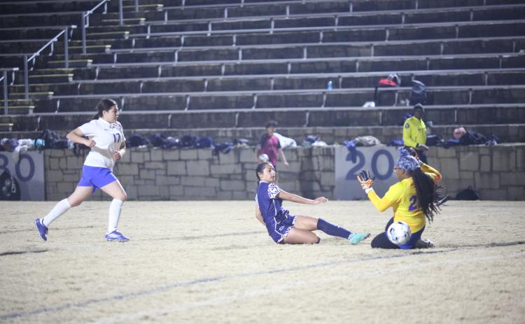 Paulina Guerrero puts the ball past the goalkeeper to score an Elbert goal during the Lady Devils’ 5-0 win over Barrow Arts and Sciences Academy Feb. 22. (Photo by Wells)